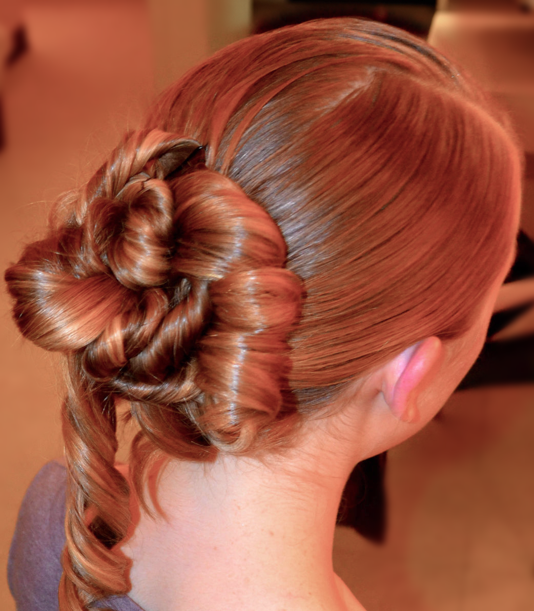 Swept runway updo with cascading curls · TEXTURES Hair Salon