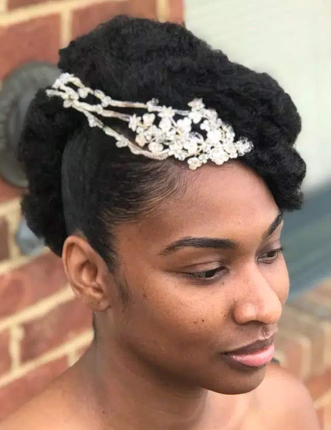 Natural bridal updo with a jeweled headpiece · front view · TEXTURES Hair Salon