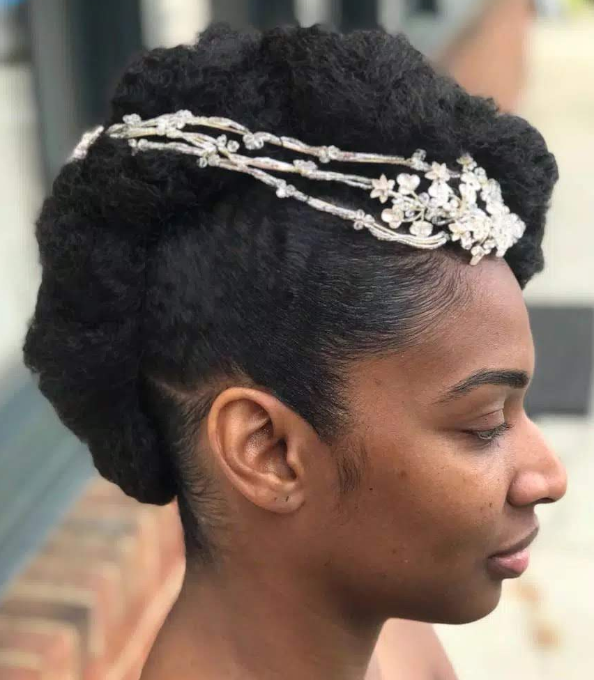 Natural bridal updo with a jeweled headpiece · side view · TEXTURES Hair Salon