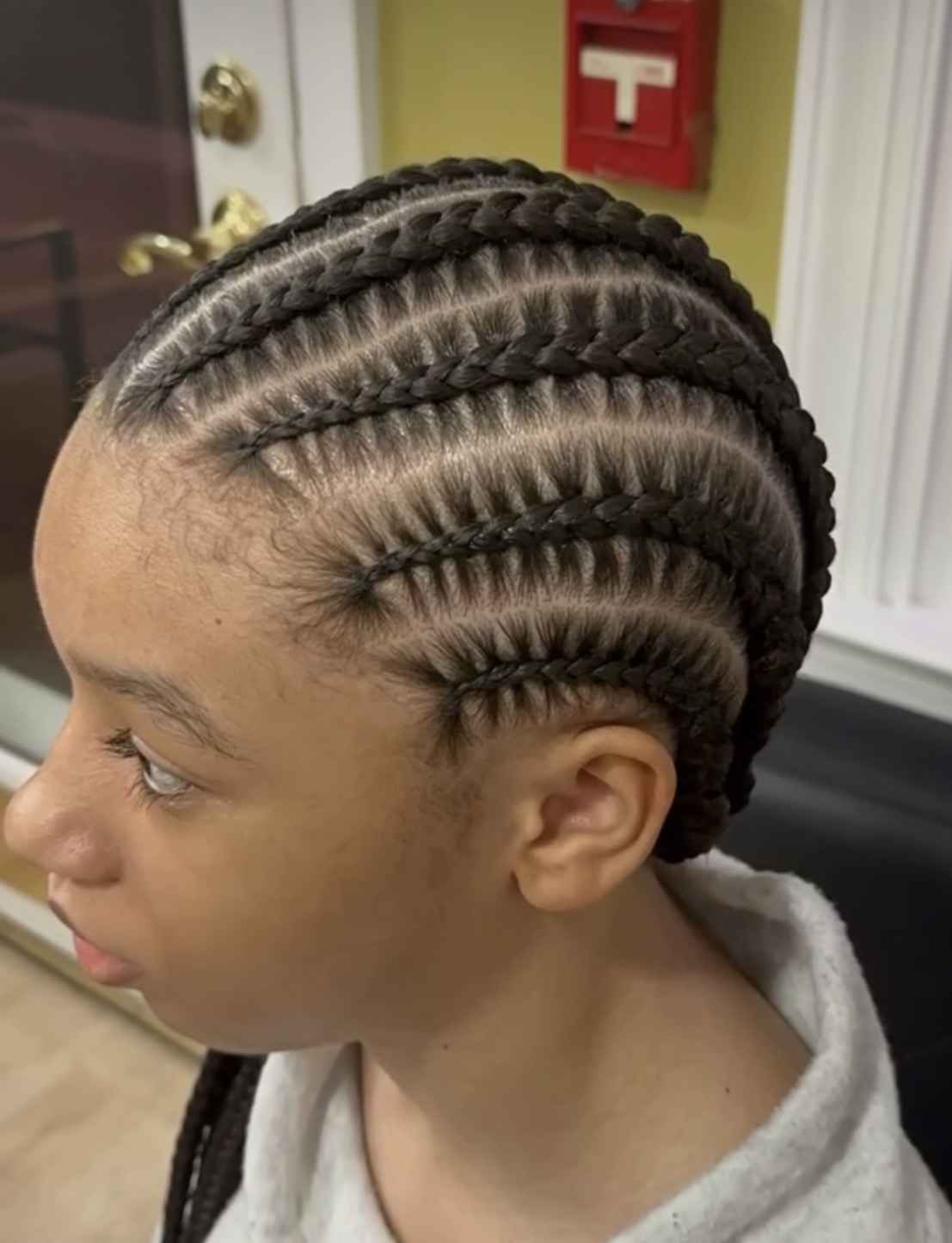 Cornrows with clean parting by Dee