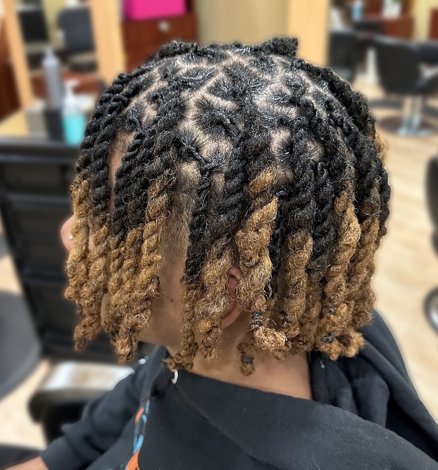 Loc twists with golden ends at TEXTURES Hair Salon