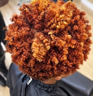 Copper and golden coils at TEXTURES Hair Salon