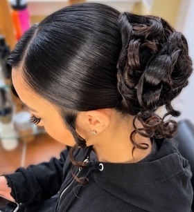 Sleek curled updo at TEXTURES Hair Salon