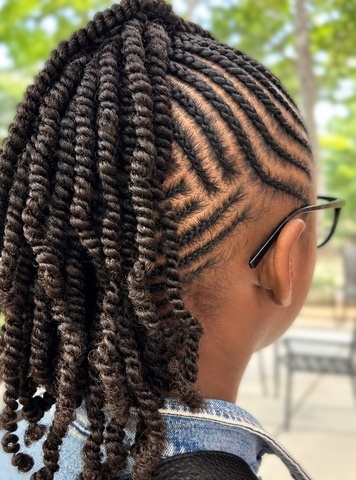 Swept-up twists with patterned parting at TEXTURES Hair Salon