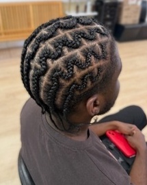 Men’s cornrows with geometric parting by Loanna