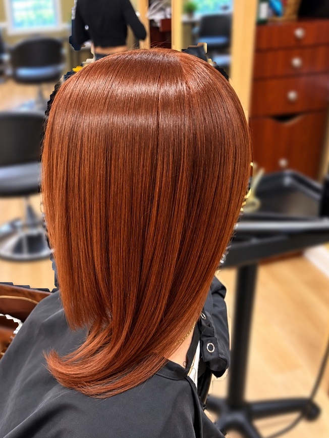 Copper-toned silk press at TEXTURES Hair Salon