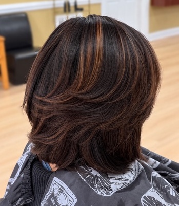 Highlighted shoulder-length layers at TEXTURES Hair Salon