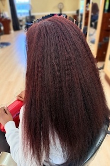 Long burgundy crochet at TEXTURES Hair Salon