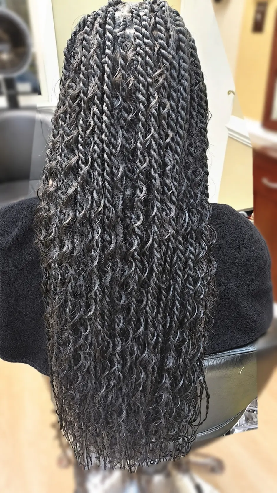 Long twists with loose curls at TEXTURES Hair Salon