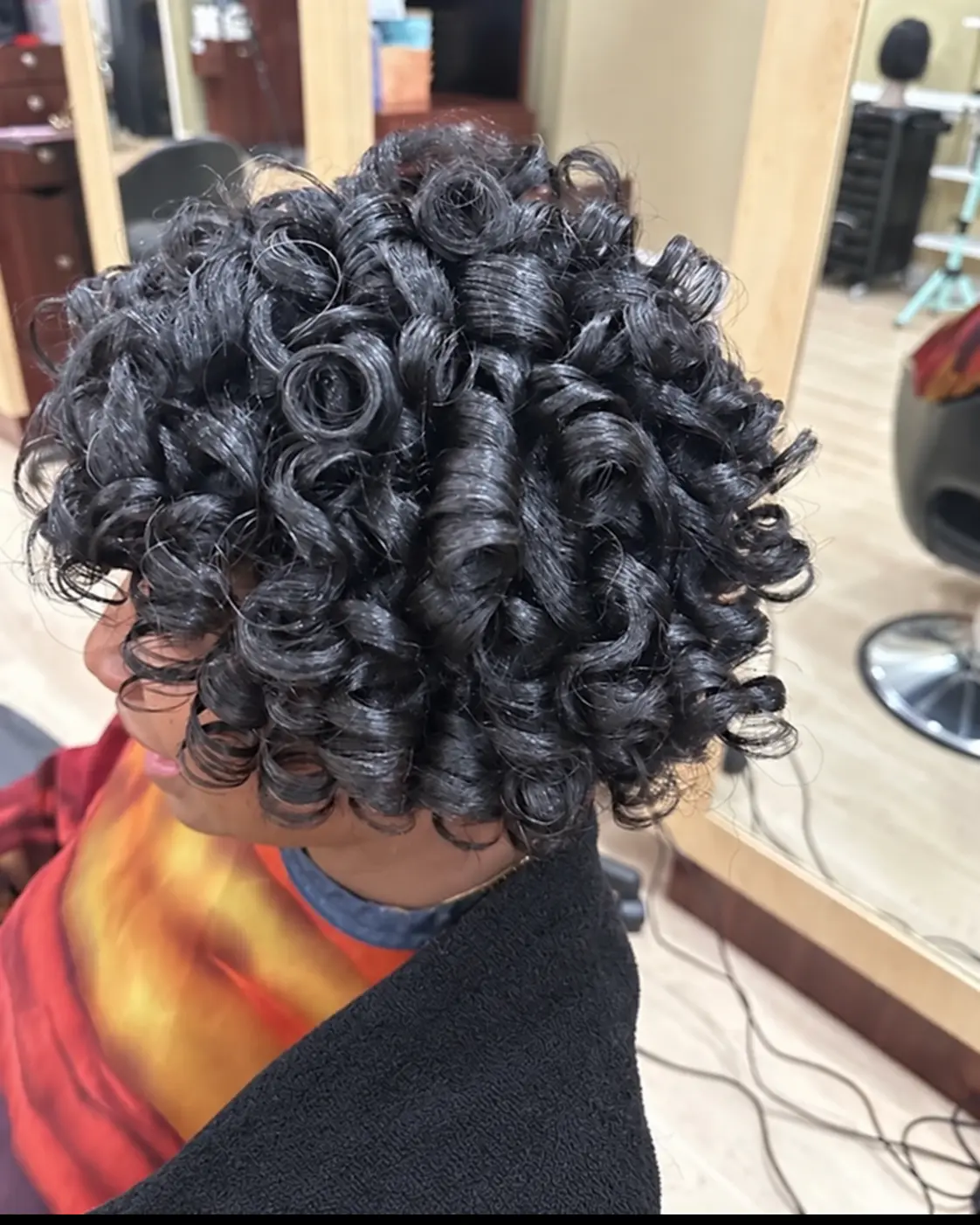 Glossy short curls at TEXTURES Hair Salon