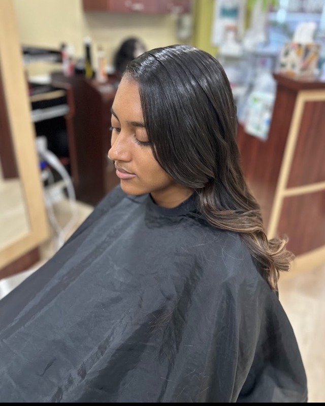 Smooth shoulder-length layers at TEXTURES Hair Salon
