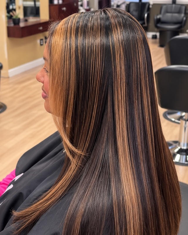 Sleek hair with caramel highlights at TEXTURES Hair Salon