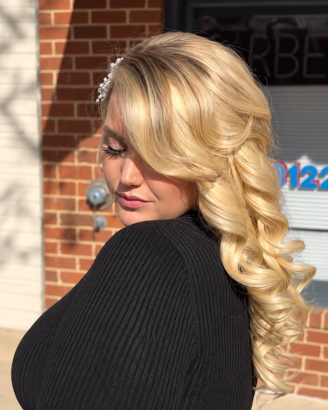 Long blonde curls at TEXTURES Hair Salon