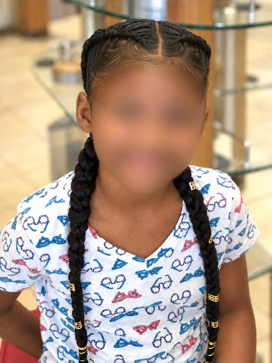 Kids’ Hair · Two braids with gold cuffs, front view · TEXTURES Hair Salon
