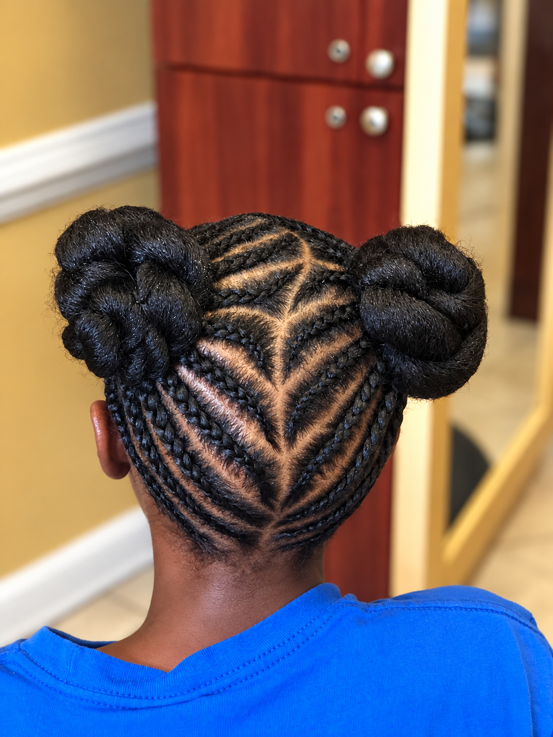 Kids’ Hair · Double buns, back view · TEXTURES Hair Salon