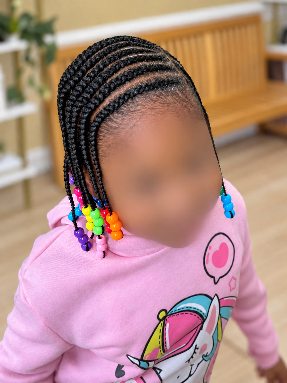 Kids’ Hair · Cornrows with rainbow beads · TEXTURES Hair Salon