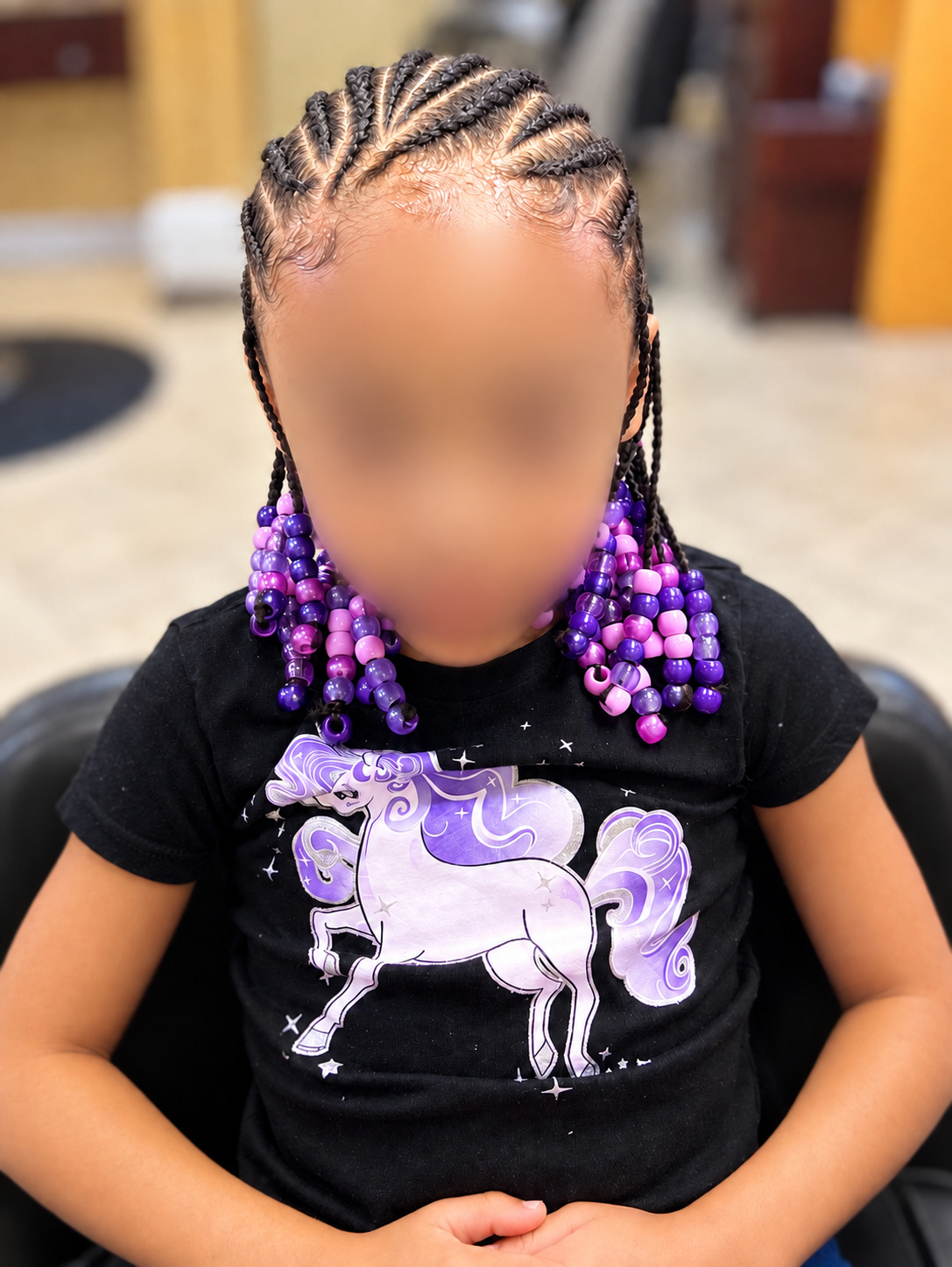 Kids’ Hair · Braids with purple beads · TEXTURES Hair Salon