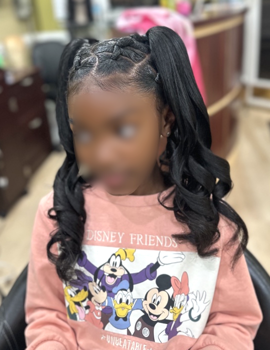 Braided double ponytails with curls · seated view at TEXTURES Hair Salon