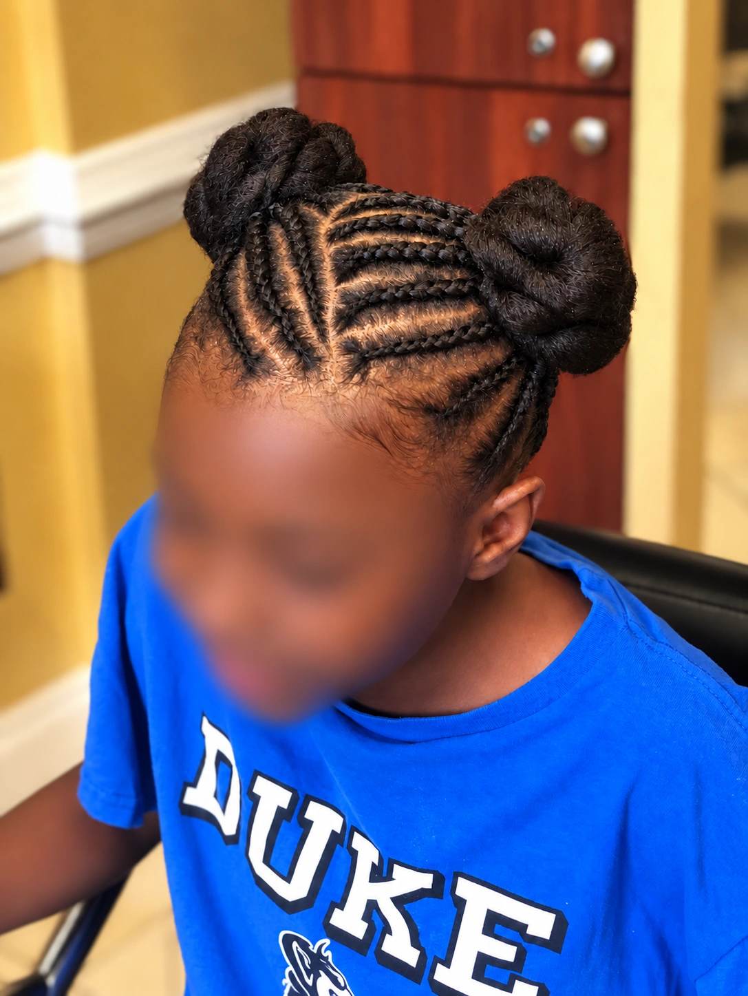 Kids’ Hair · Cornrows with double buns · TEXTURES Hair Salon