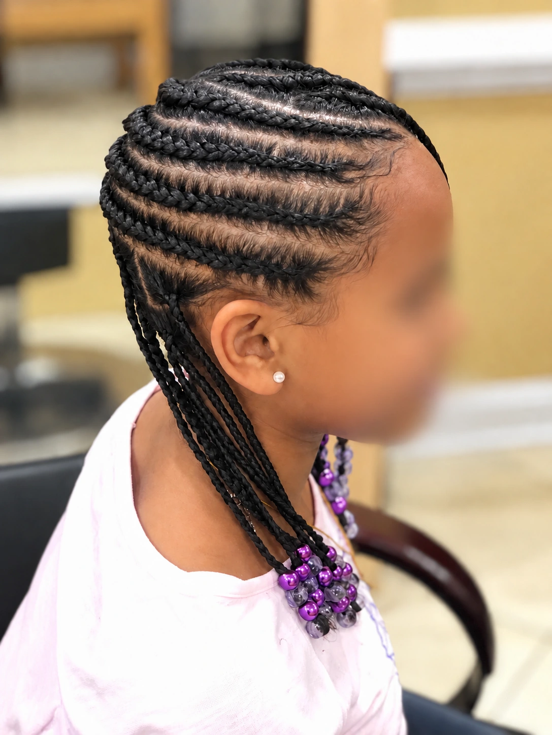 Kids’ Hair · Cornrows with purple beads · TEXTURES Hair Salon