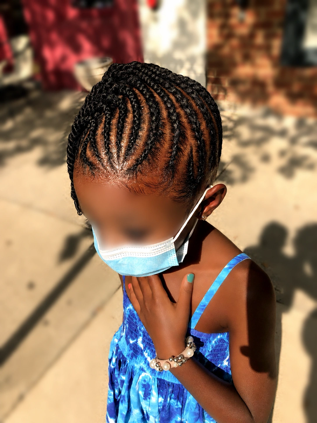 Kids’ curved cornrows · front view at TEXTURES Hair Salon