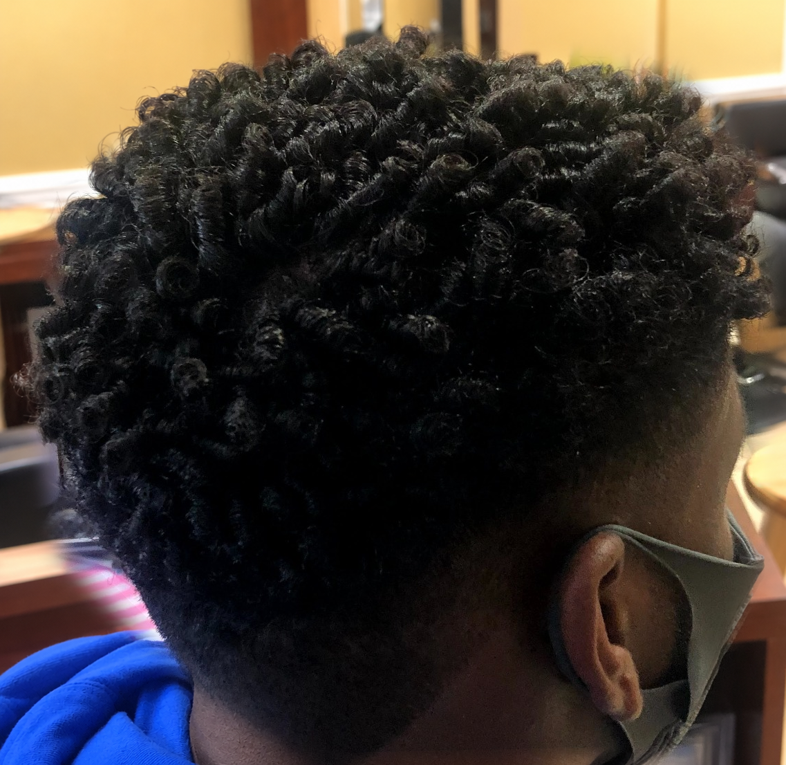 Defined curls · back and side view at TEXTURES Hair Salon