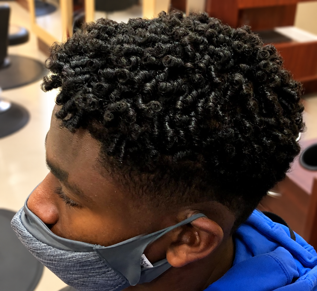 Defined curls · side view at TEXTURES Hair Salon