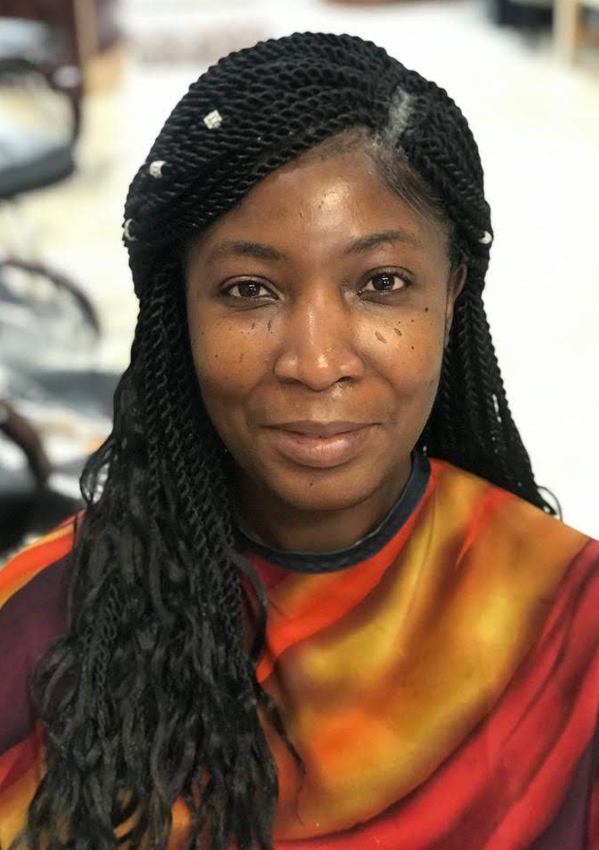 Side-parted twists with curled ends at TEXTURES Hair Salon