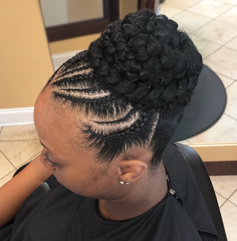 Cornrow braided updo at TEXTURES Hair Salon