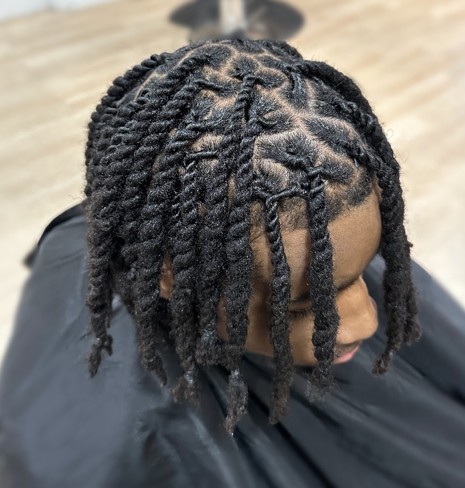 Loc twists with sectioned parting at TEXTURES Hair Salon