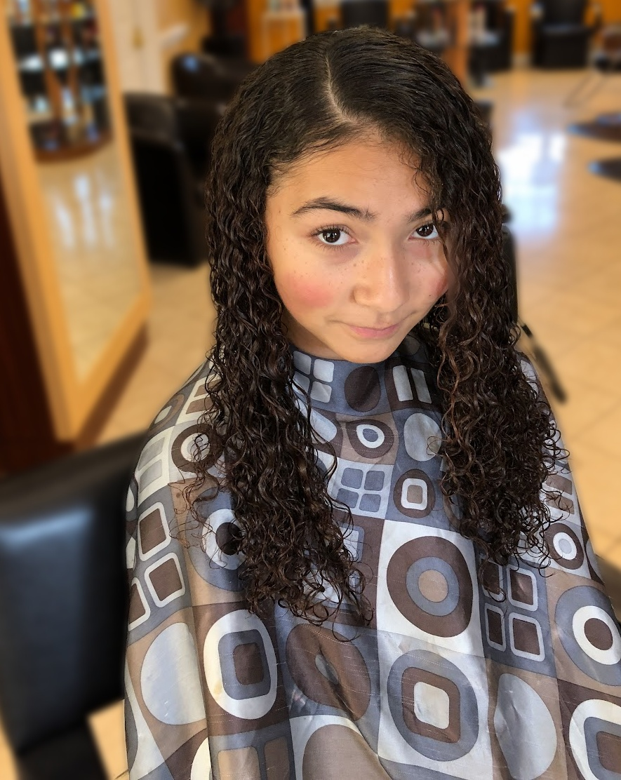 Long defined natural curls at TEXTURES Hair Salon