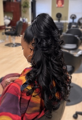 Long cascading dark curls at TEXTURES Hair Salon