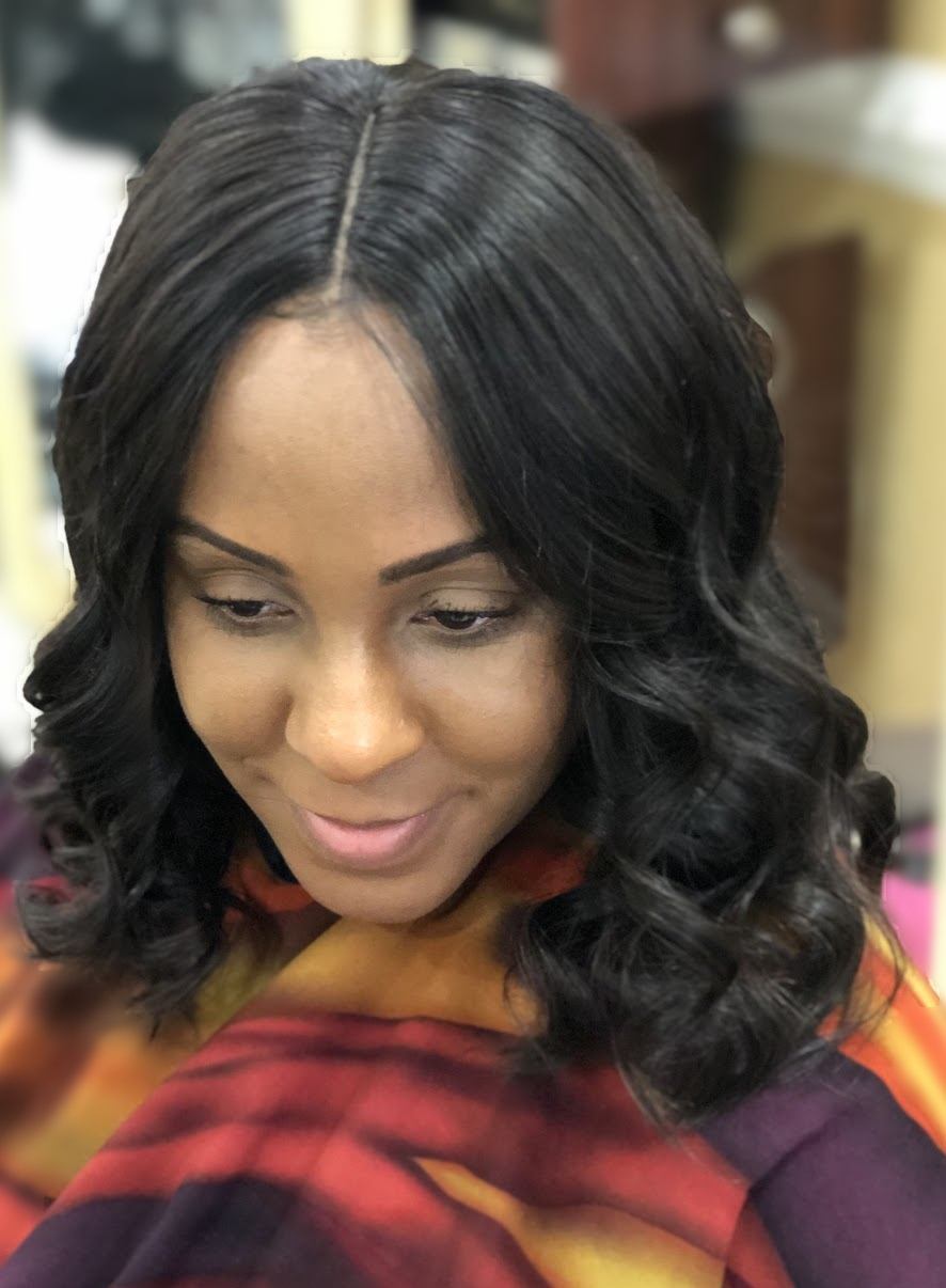 Wig install with shoulder-length curls at TEXTURES Hair Salon
