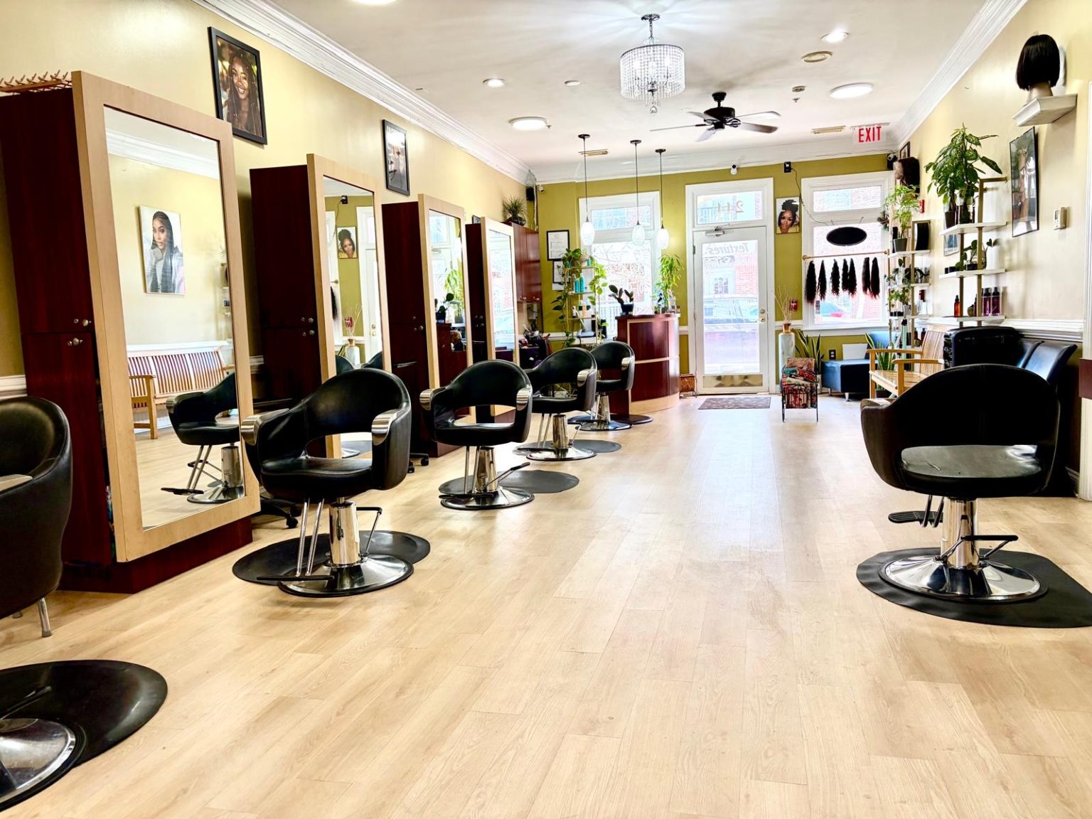 Inside TEXTURES Hair Salon, with styling chairs and mirrored stations