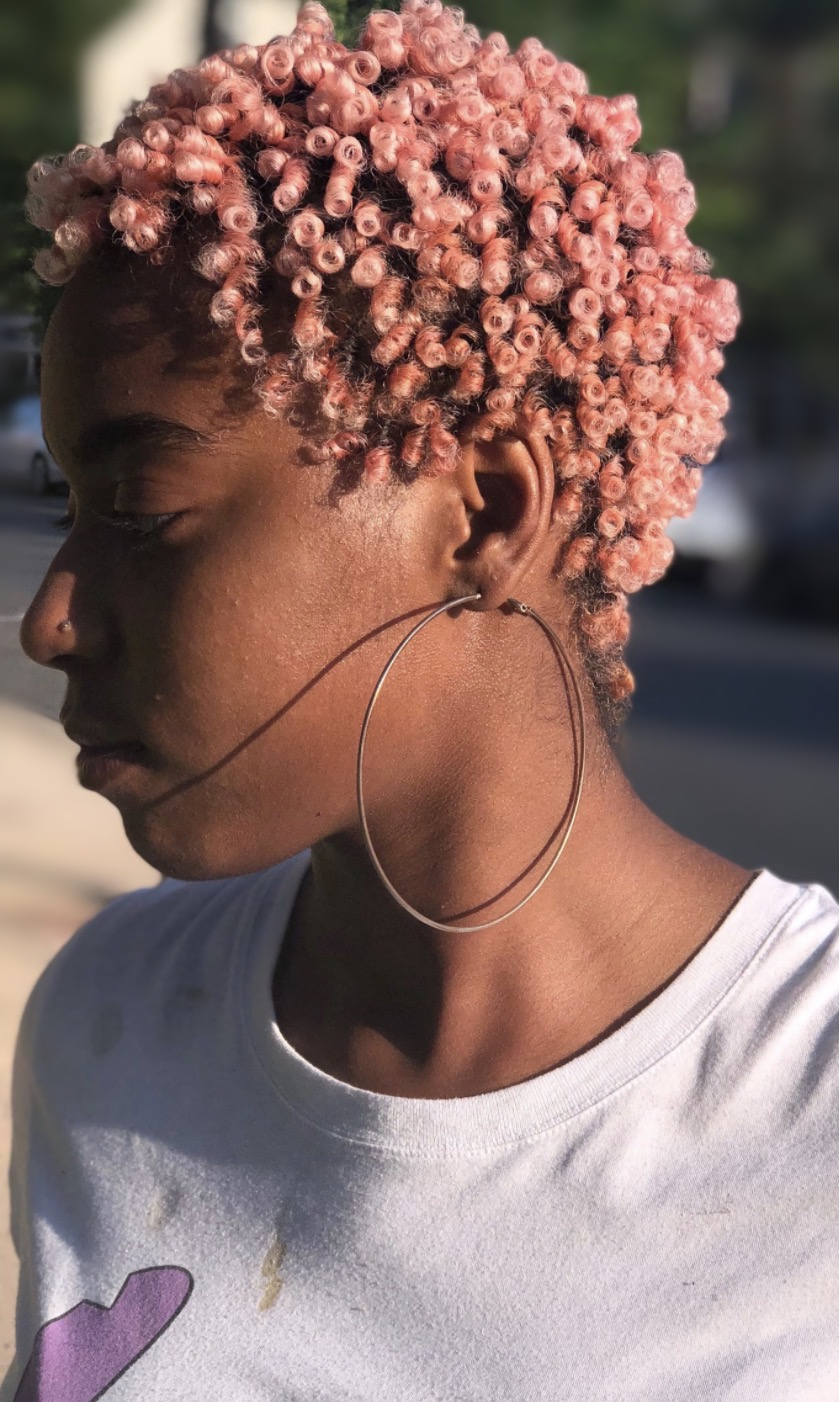 Rose-toned defined curls at TEXTURES Hair Salon