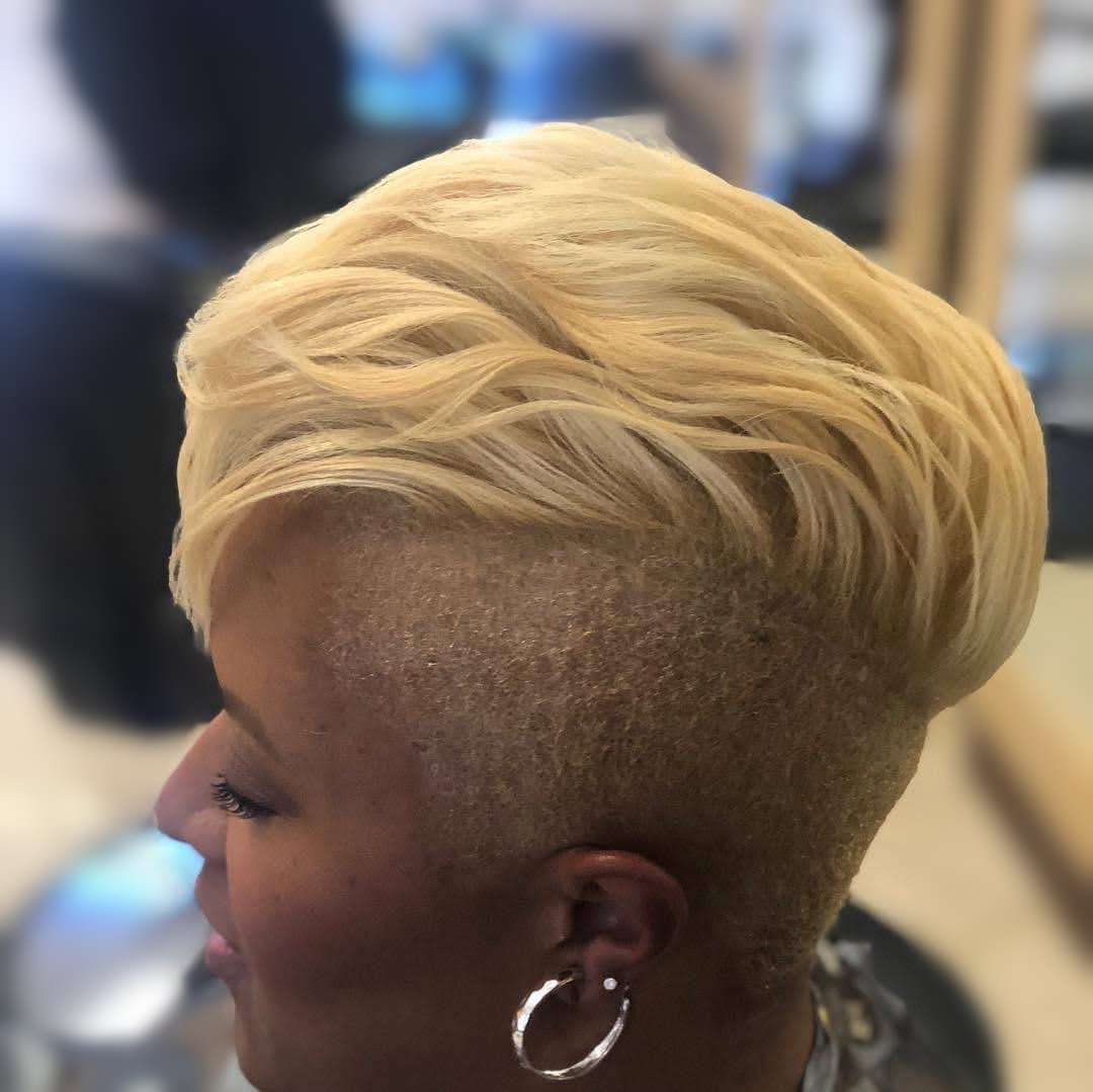 Blonde swept pixie with a tapered side at TEXTURES Hair Salon