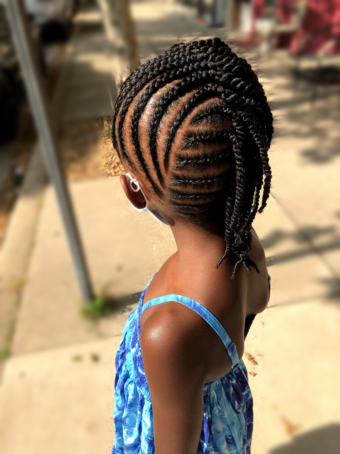 Kids’ curved cornrows · back view at TEXTURES Hair Salon