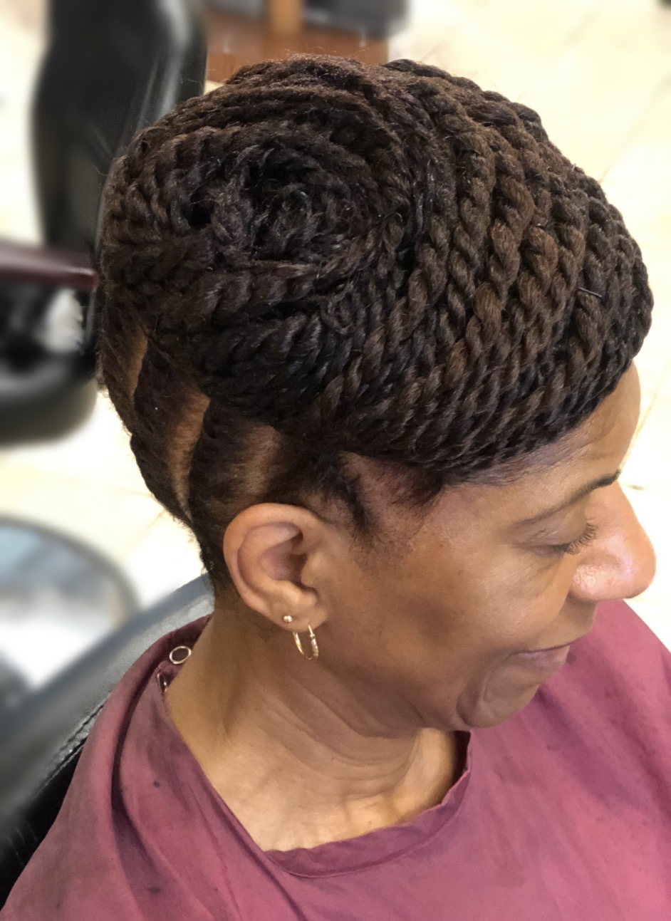 Swept flat-twist updo at TEXTURES Hair Salon